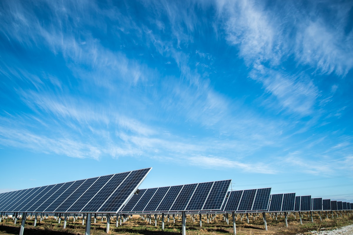 Solar technicians inspecting solar module arrays